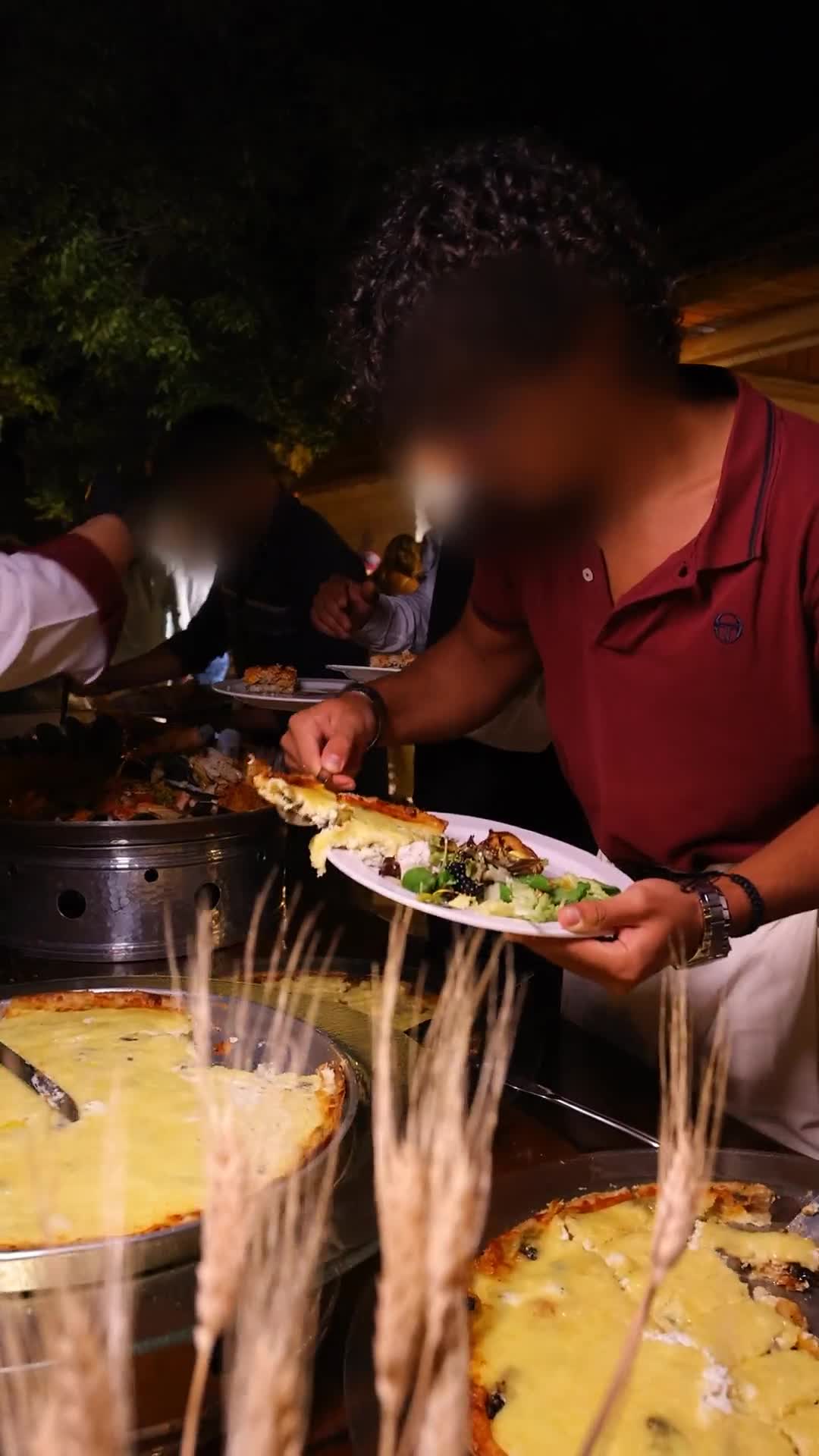 Guest served from a live cheese pie station at an Alam Catering event in Lebanon